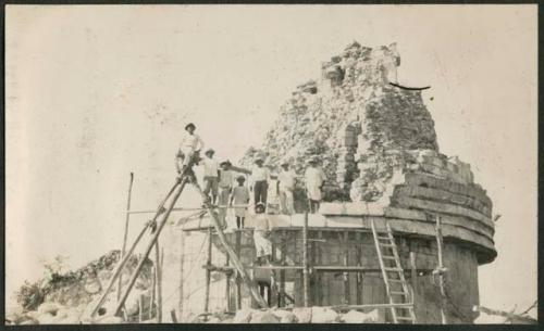 Caracol, raising stone block for restoration in five-member cornice