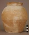 Small mottled tan and white ware urn