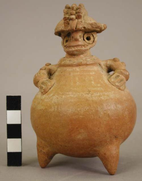 Hollow clay white-line figurine.