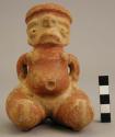 Red and buff hollow seated female effigy figurine