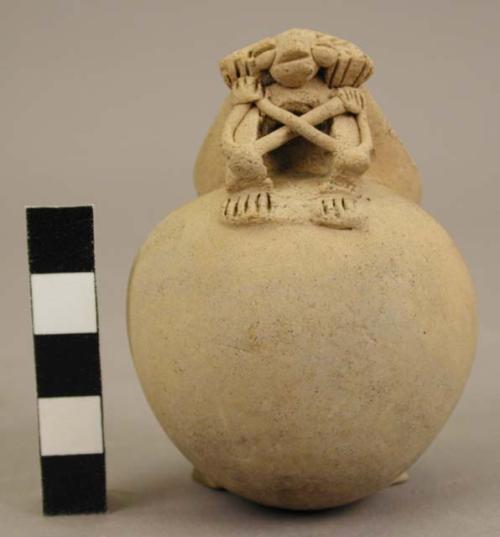 Small vessel, raised figure on one side