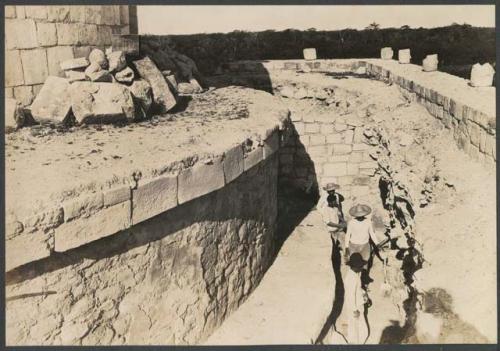 El Caracol, masons walling up pit exposing 1929 circular structure