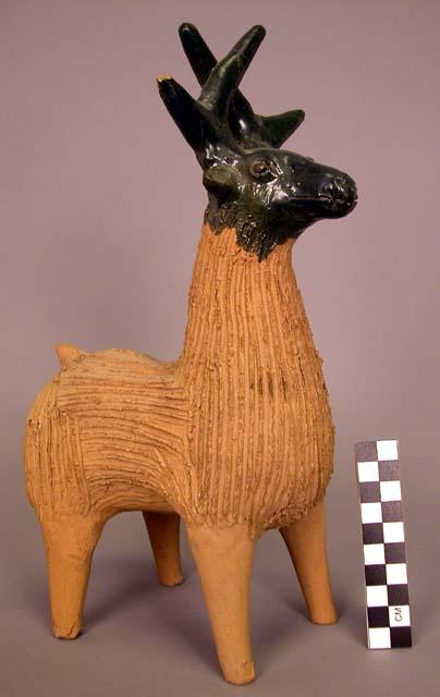 Ceramic partially glazed deer figurine