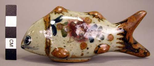 Ceramic blue, brown red + green on grey fish figurine, glazed.