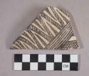 Ceramic rim sherd with polychrome designs