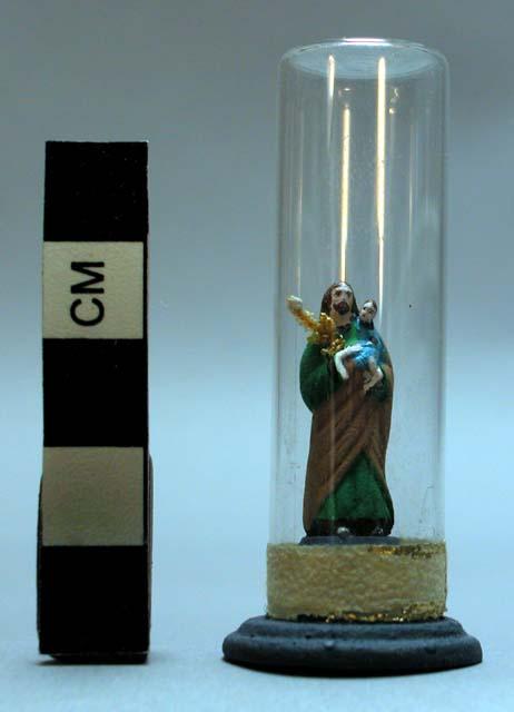 Ceramic polychrome miniature santo in glass bell jar