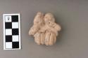 Seated clay figure (twins)