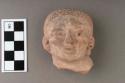 Archaic pottery figurine- large head with pitted hair