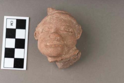 Archaic pottery figurine- large head