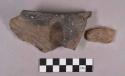 Ceramic, earthenware rim and body sherds, shell-tempered, incised and cord-impressed, one with strap handle