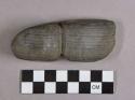 Ground stone, grooved object, fragment