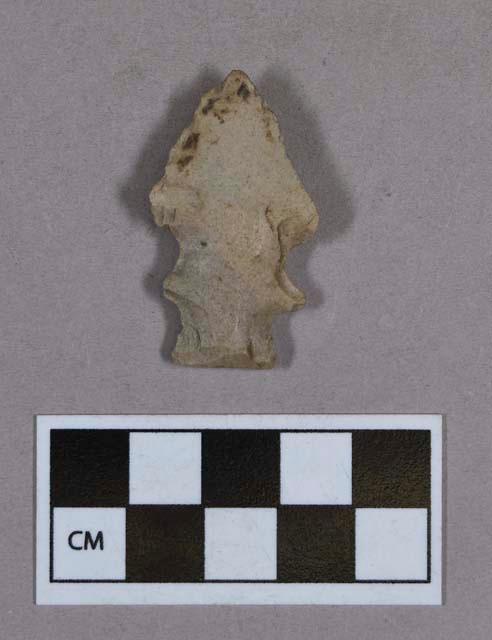 Chipped stone, eccentric projectile point, side-notched