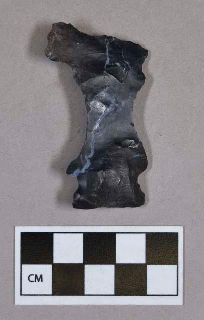 Chipped stone, eccentric biface, L-shaped, side-notched