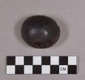 Ground stone, hemisphere-shaped object, polished, hematite