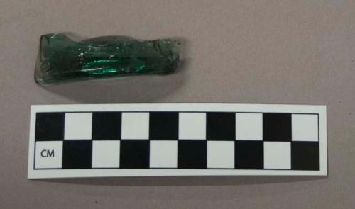 Glass, deep aqua bottle base fragment