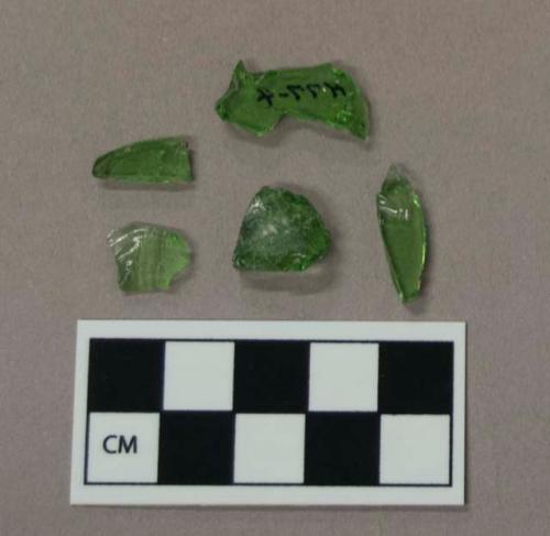 Glass, green curved and flat bottle fragments