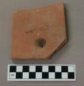 Ceramic, roof tile fragment with hole