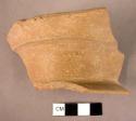 Ceramic body sherd, buff, footed, flared base