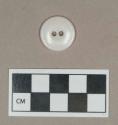 Synthetic, white plastic two hole button