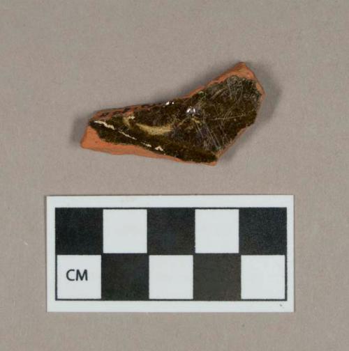 Ceramic, lead glazed redware base sherd