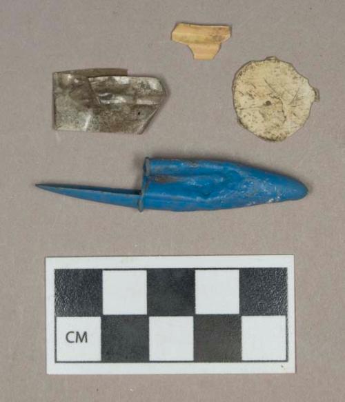 Synthetic, plastic fragments including pen cap and wrapper