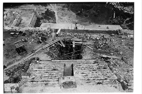 Caracol. Trench at base of upper stairway showing poles placed to prevent walls