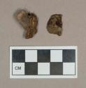 Metal, unidentified metal fragments attached to stone