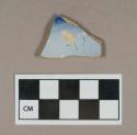 Ceramic, pearlware body sherd with flow blue decoration on interior