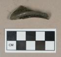 Glass, olive green bottle base/heel fragment