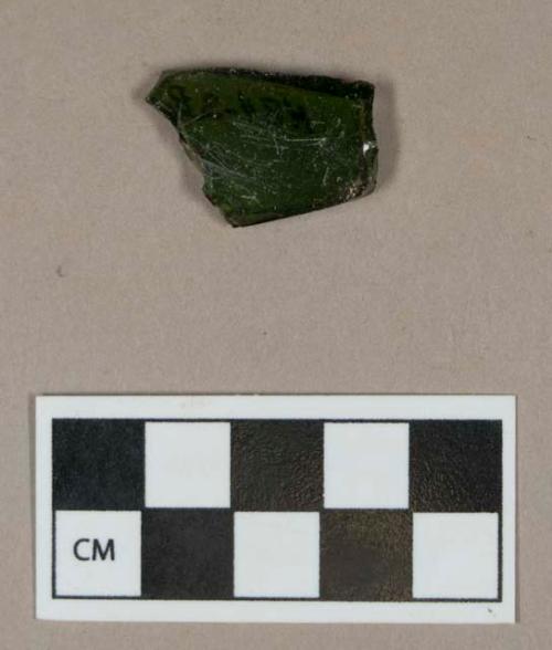 Glass, dark green bottle body fragment