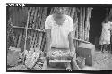 Corn grinding - Bernadino Tun's wife.