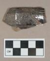 Ceramic, dark brown lead glazed redware rim sherds