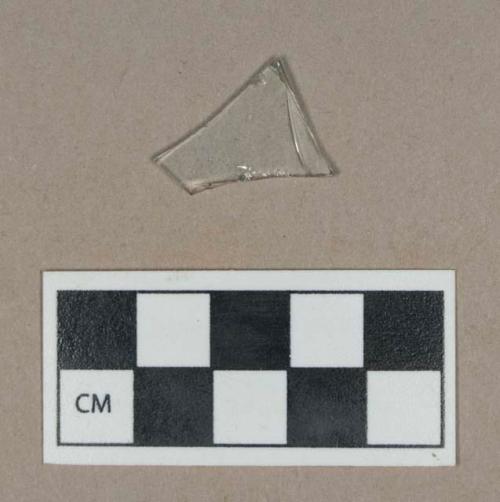 Glass, colorless flat glass fragment