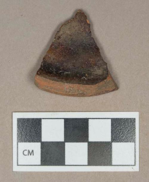 Ceramic, redware base sherd with interior glaze