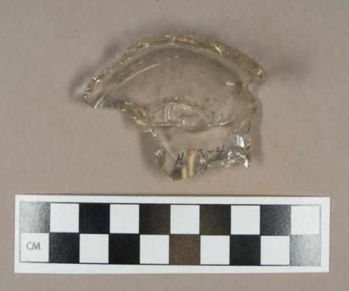 Glass, colorless molded bottle base fragment