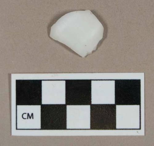 Glass, curved milk glass body fragment