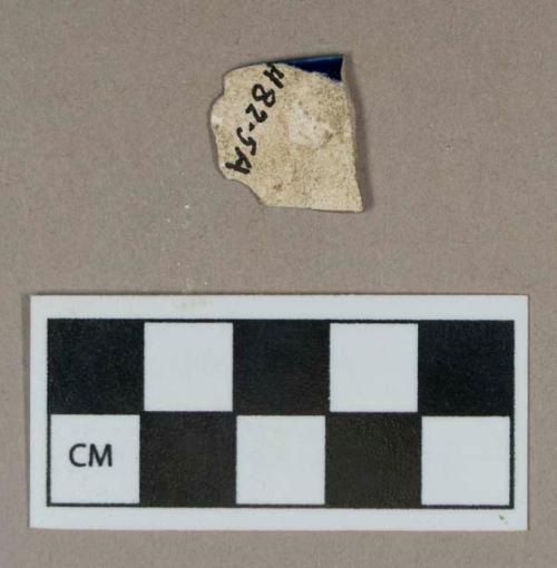 Ceramic, pearlware rim sherd, blue edge-decorated