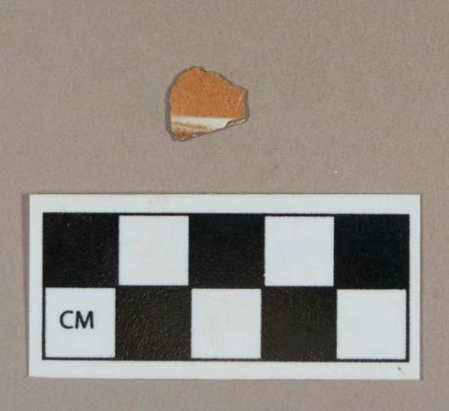 Ceramic, refined earthenware body sherd, solid field decorated