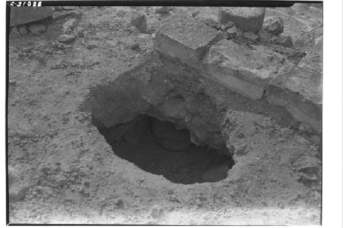 Caracol, olla under block of masonry top of niche - upper stairway.