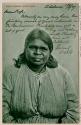 A postcard of an Aboriginal woman in European dress