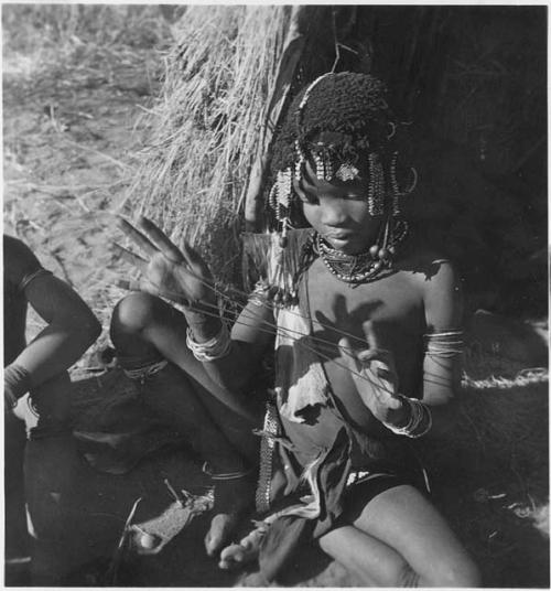 Girl making a "cat's cradle"