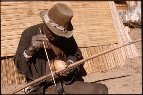 Man playing a musical bow