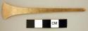 Flat undecorated gold chisel.  (flared at one end, tapered at other)