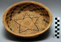 Coiled basket with black and brown design