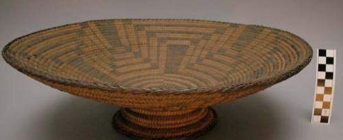 Pedestal-based bowl, coiled. Made of yucca, bear grass, and devil's claw.