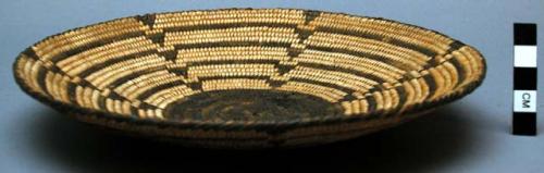 Basketry plate, coiled. Geometric designs.