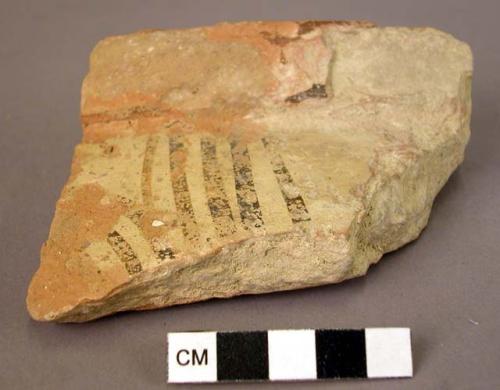 Rim potsherd, lustrous paint, apparently spiral design