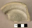 Pottery foot fragment, grey Minyan