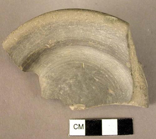 Pottery foot fragment, grey Minyan