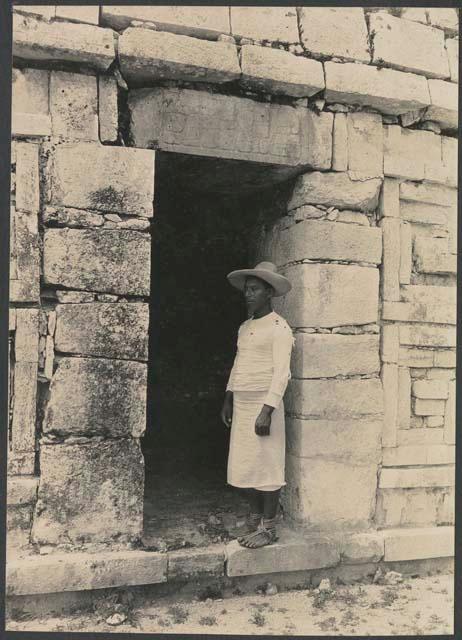 Santiago Cupul of Piste, in doorway wearing hat